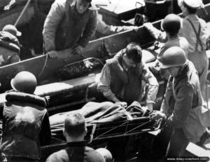Evacuation of wounded soldiers carried aboard an LCVP off the coast of Normandy in the English Channel. Photo: US National Archives