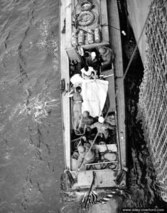 Evacuation of wounded soldiers carried aboard an LCVP off the coast of Normandy in the English Channel. Photo: US National Archives