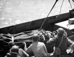 Evacuation of wounded soldiers carried aboard an LCVP off the coast of Normandy in the English Channel. Photo: US National Archives