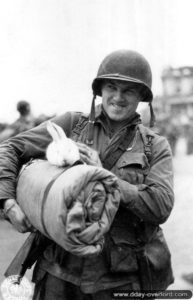 July 11, 1944: Corporal Michael Deliman returning from the Normandy front lands in England. Photo: US National Archives