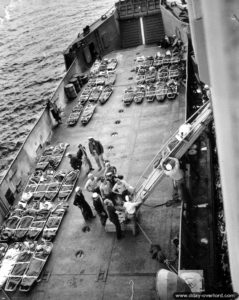 Evacuation of casualties carried aboard an LCM off the coast of Normandy in the English Channel. Photo: US National Archives