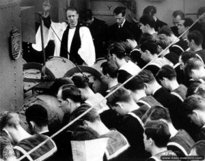 A chaplain celebrates Mass on HMCS Algonquin during the crossing of the English Channel. Photo: US National Archives