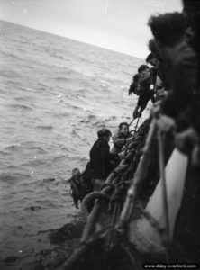 Survivors of two American LSIs sunk during an attack on a German E-Boat are recovered aboard HMS Beagle in the English Channel. Photo: IWM