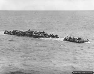 A ferry "rhino" packed with equipment heads towards the shore to unload his precious cargo. Photo: US National Archives