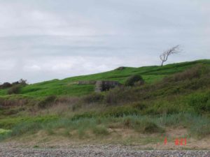 Vue générale du point d'appui allemand codé Wn 62 à Omaha Beach (Colleville-sur-Mer), observée depuis la plage. Photo : D-Day Overlord